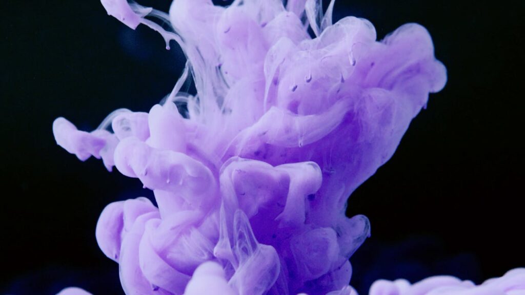 Crafting Captivating Headlines: Your awesome post title goes here Vibrant purple ink swirl creating an abstract visual against a dark backdrop.