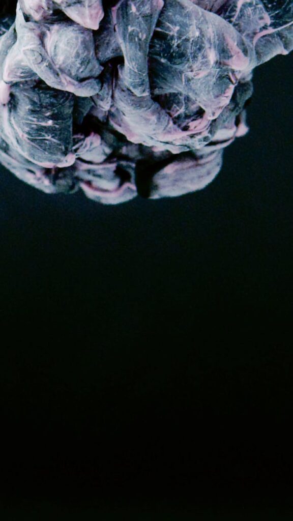 The Art of Drawing Readers In: Your attractive post title goes here Abstract acrylic paint in vibrant colors forming dynamic patterns on a black background.